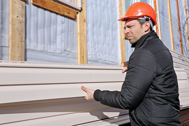 Vinyl Siding Installer Using Power Tools